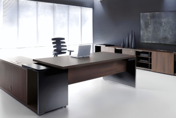 Executive desk with a distinctive design made of MDF wood and PVC veneer, supported by a side panel
