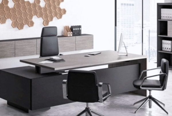 Executive desk with a distinctive design made of MDF wood and PVC veneer, supported by a side panel