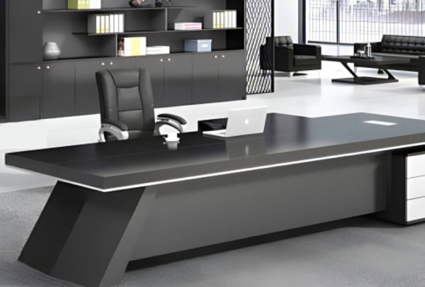 Executive desk with a distinctive design made of MDF wood and PVC veneer, supported by a side panel