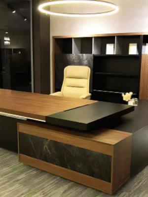 Executive desk with a distinctive design made of MDF wood and PVC veneer, supported by a side panel